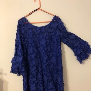 Bluish purple dress. Above knee.